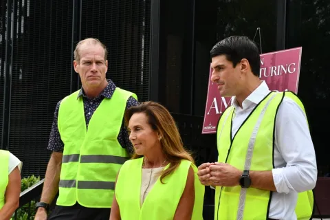 Left to right: Chris Hackett, Chairwoman McClain, and Rep. Bresnahan speak with reporters following their tour of the i2M facility.