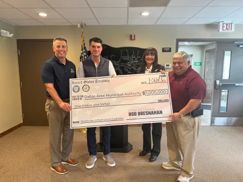 Rep. Bresnahan presents a check from $1,000,000 to the Dallas Area Municipal Authority.