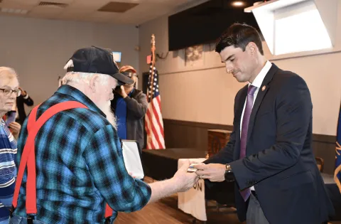 Rep. Bresnahan presents Don Schaller with his father’s Bronze Star Medal